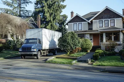 Moving Truck Parked In Residential Driveway