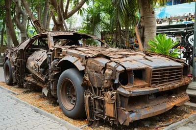 Rusted Wrecked Muscle Car Sculpture In Urban Park