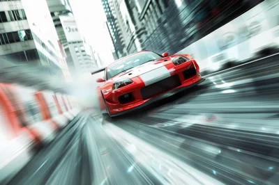 Red Toyota Supra Drifting Through City Streets