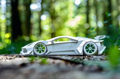 Papercraft Sports Car Model In A Forest Setting