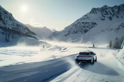 Silver Sports Car Drifting On Snowy Mountain Road