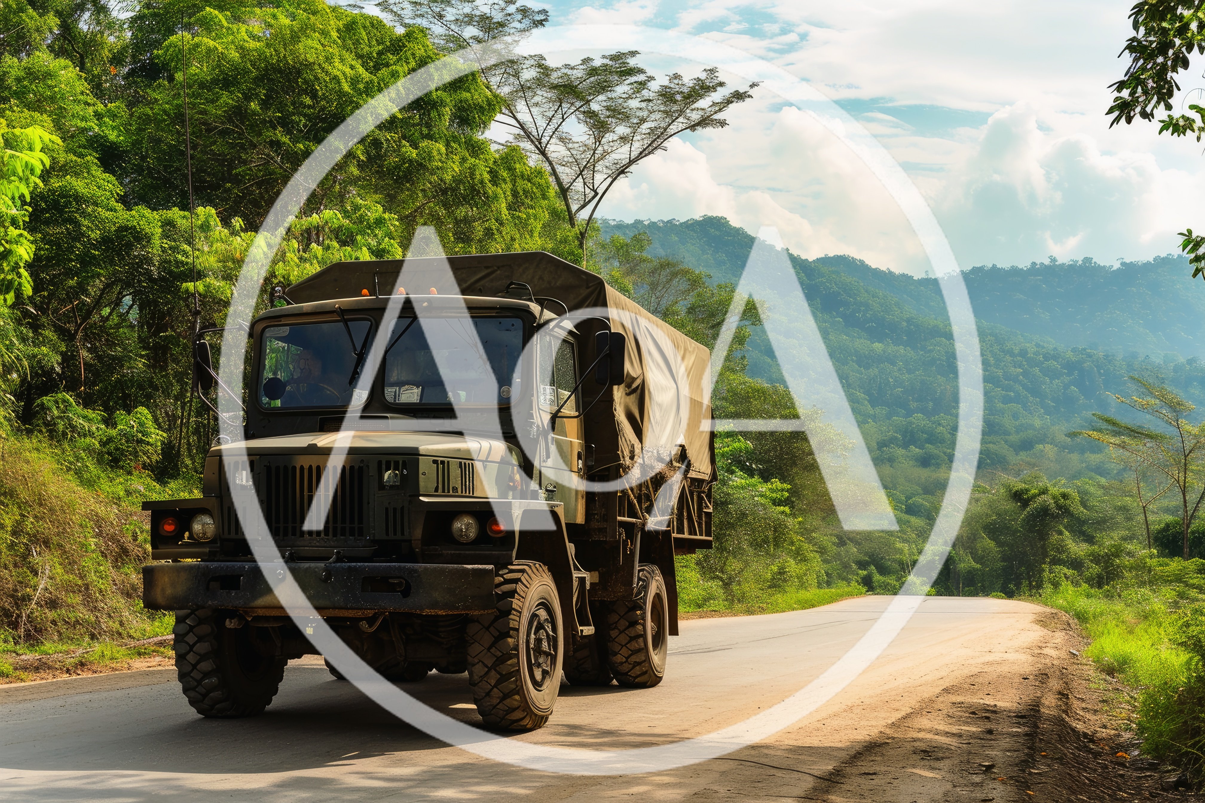 Military Cargo Truck Driving on a Mountain Road