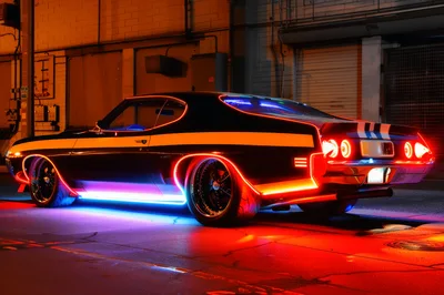 Custom Muscle Car With Neon Lighting At Night