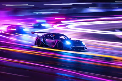 Racing Sports Car Drifting On Neon Lit Track