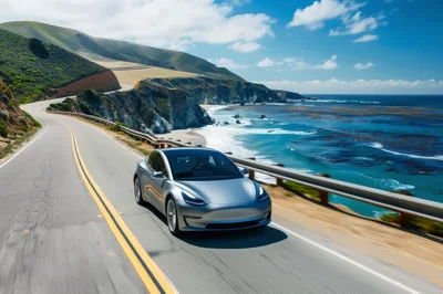 Silver Tesla Model 3 Driving Along Big Sur Coastline