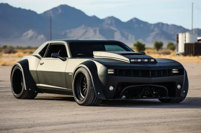 Custom Matte Black Muscle Car In Desert Landscape