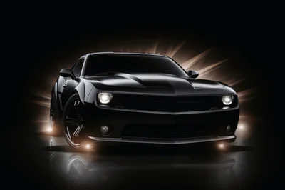 Black Muscle Car With Glowing Headlights In Dark Studio