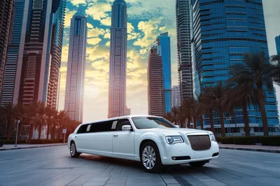 White Stretch Limousine Parked In Modern Dubai Cityscape