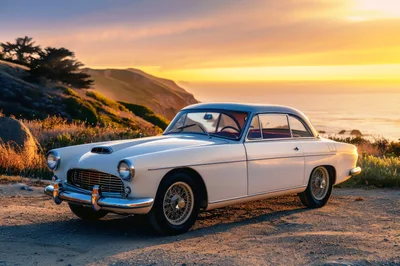 Vintage White Sports Car Parked On Coastal Cliffside