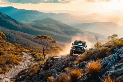 Off-Road Jeep Driving On Mountain Trail At Sunset