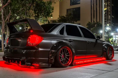 Modified Matte Black Subaru WRX STI at Night