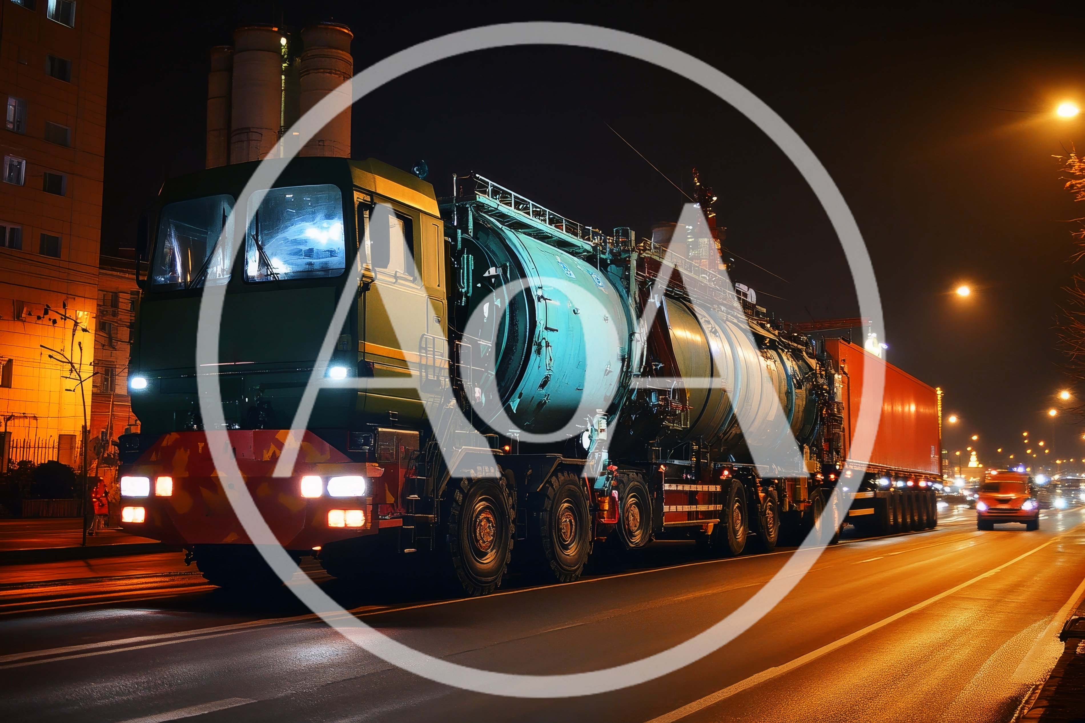 Heavy Duty Industrial Truck Transporting Large Tank At Night