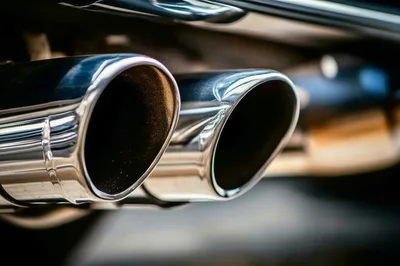 Close Up Of Shiny Chrome Car Exhaust Pipes