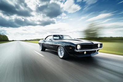 Black Classic Muscle Car Driving Fast On Highway