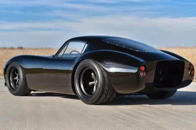 Custom Black Sports Coupe Parked On Asphalt
