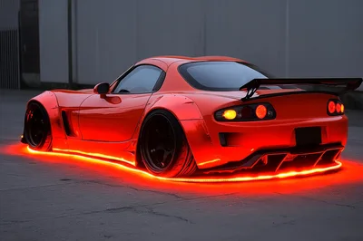 Modified Red Sports Car With Underglow Lighting