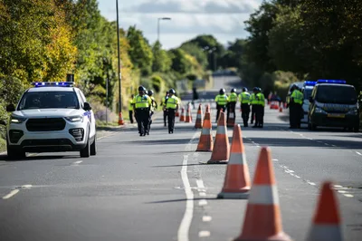 Police Officers Managing Traffic at Roadside Incident