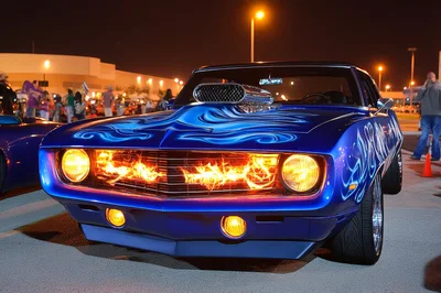Custom Blue Muscle Car With Flaming Grille At Night
