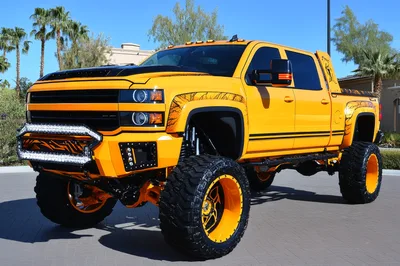 Custom Lifted Yellow Chevrolet Silverado Pickup Truck