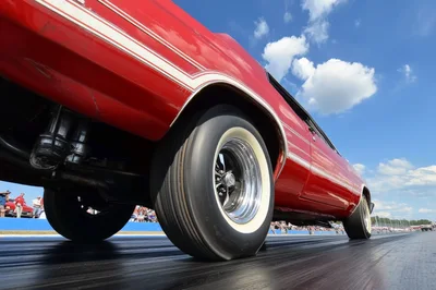 Red Muscle Car Launching On Drag Strip