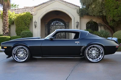 Custom Matte Black Chevrolet Camaro Parked In Driveway