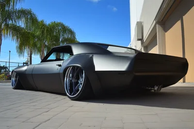 Custom Matte Black Muscle Car Parked Outdoors