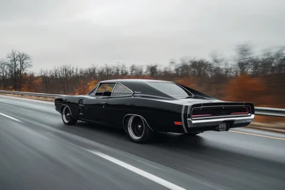 Black Dodge Charger Driving On A Highway
