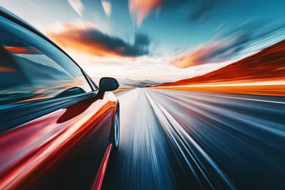 Red Sports Car Driving Fast On Highway