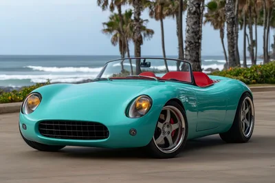 Teal Vintage Style Roadster Parked By The Ocean