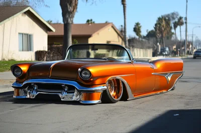 Custom Orange Lowrider Convertible Parked On Suburban Street