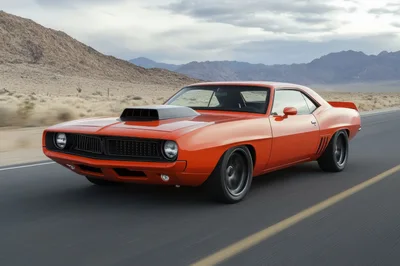 Orange Muscle Car Driving On Desert Highway