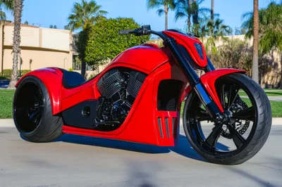 Custom Red Chopper Motorcycle Parked Outdoors