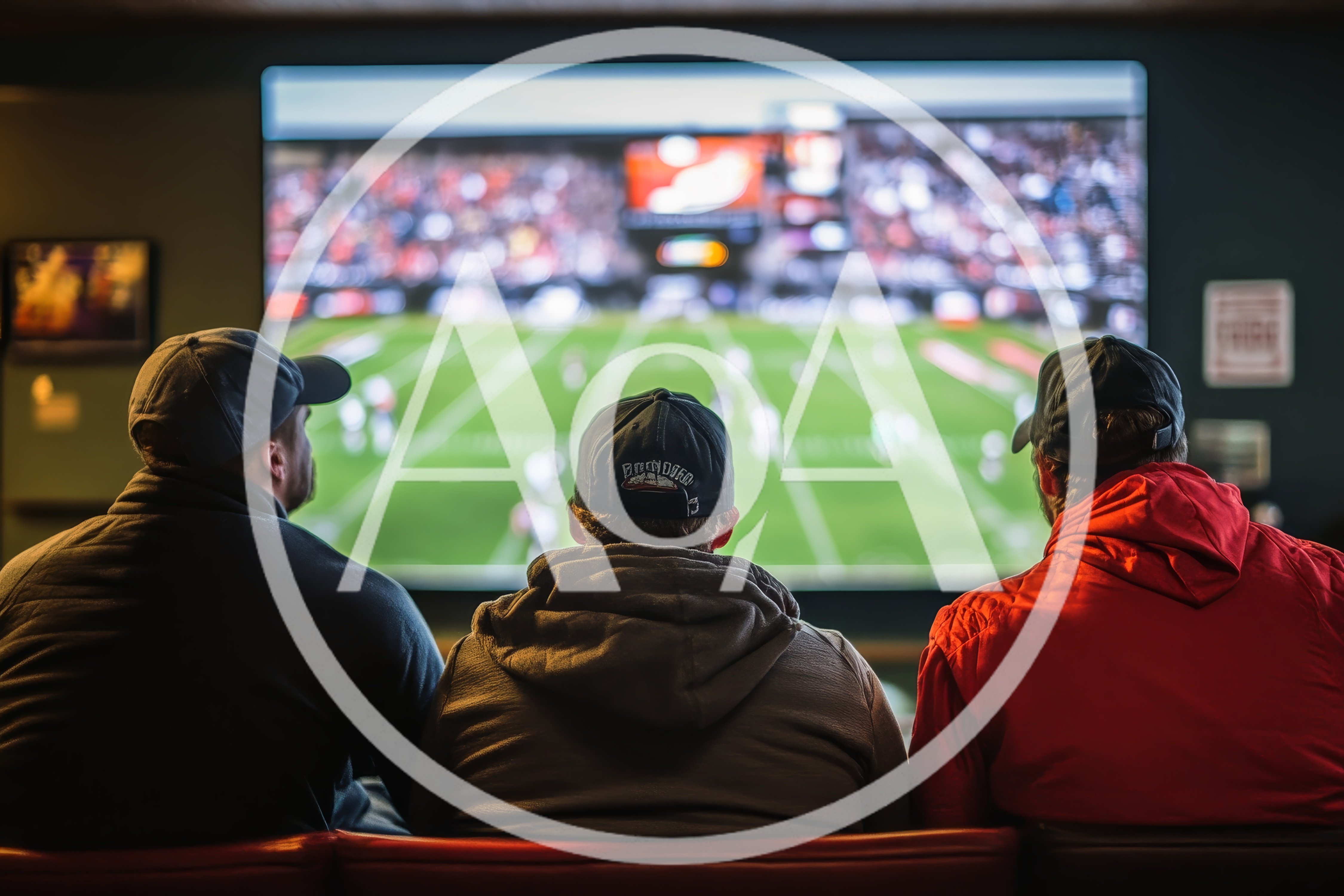 Three Men Watching Football Game On Large Screen