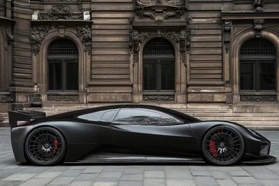 Matte Black Supercar Parked In Front Of Historic Building