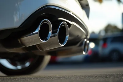 Close Up Of Chrome Dual Exhaust Pipes On Car