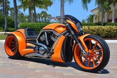 Custom Orange V-Rod Motorcycle Parked Outdoors