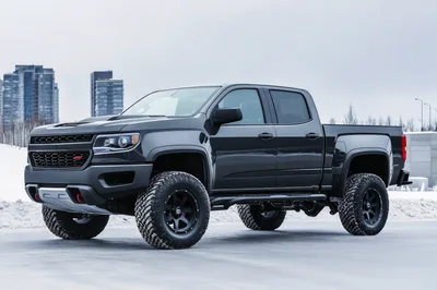 Black Chevrolet Colorado Pickup Truck In Snowy Landscape