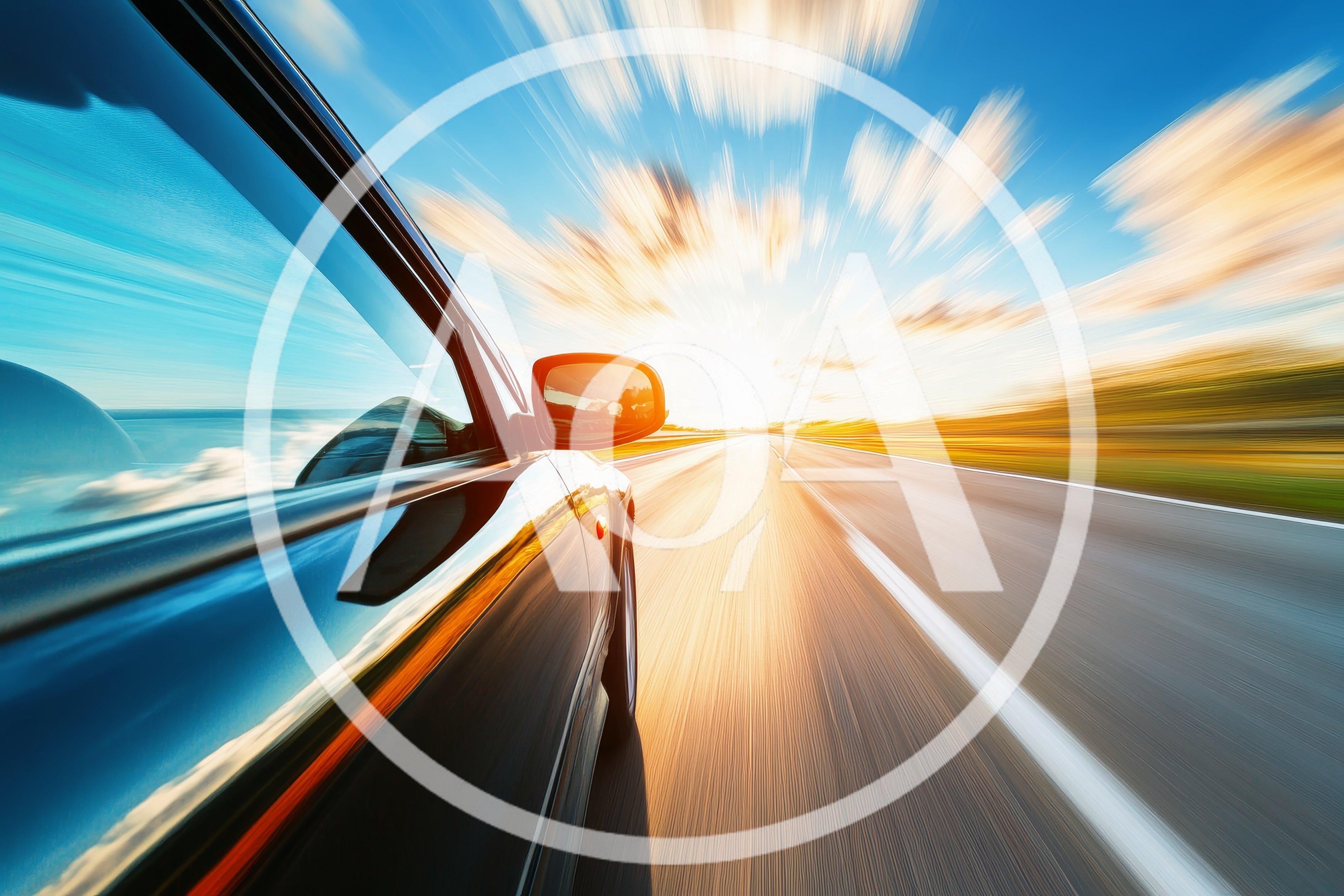 Black Car Driving Fast On A Highway At Sunset
