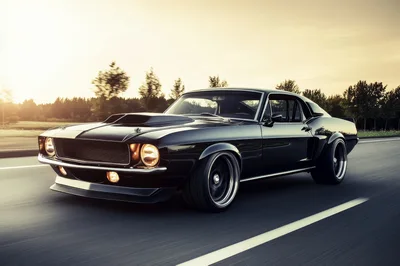 Black Classic Muscle Car Driving On Highway