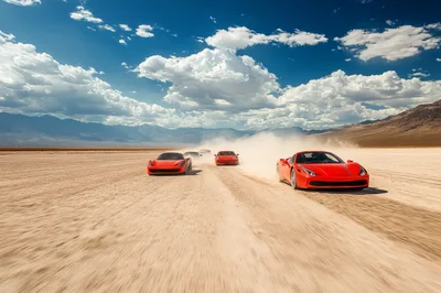 Red Sports Cars Racing Across Dry Desert Lake Bed