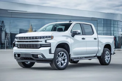White Chevrolet Silverado Pickup Truck Parked Outside Dealership