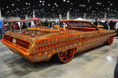 Custom Orange Lowrider Convertible at Indoor Car Show