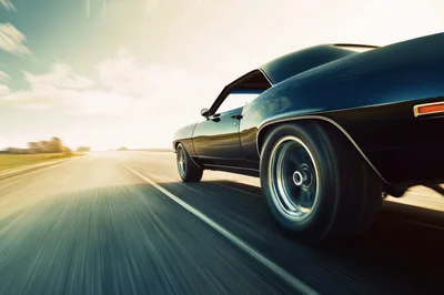 Classic Muscle Car Driving Fast On Open Highway