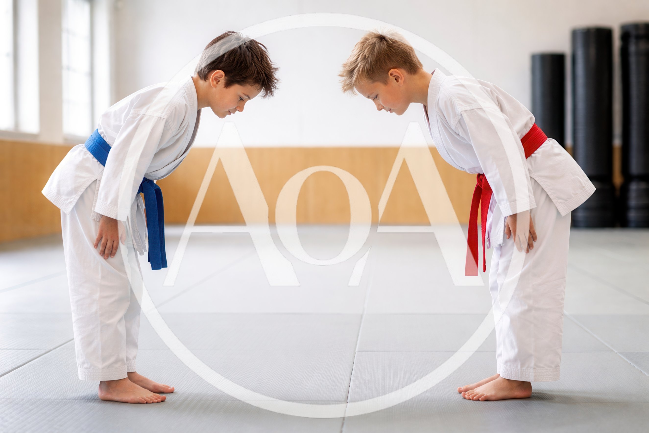 Two Young Boys Bowing In Karate Uniforms