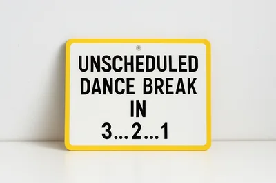 Unscheduled Dance Break Sign on White Background