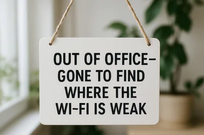 Out Of Office Sign Hanging In A Bright Office