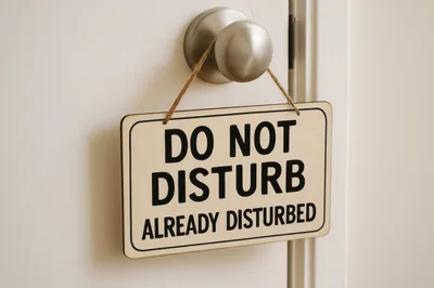Do Not Disturb Sign Hanging on a Door Knob