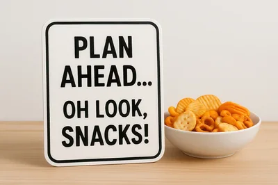 Sign With Funny Text Next To Bowl Of Snacks