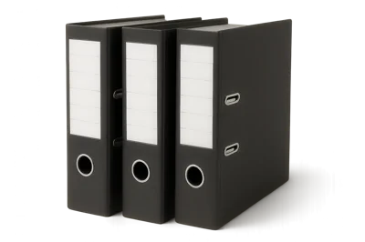 Three Black Office Ring Binders Standing Upright