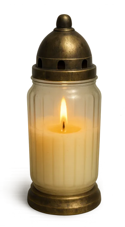 Lit Memorial Candle In A Glass Lantern